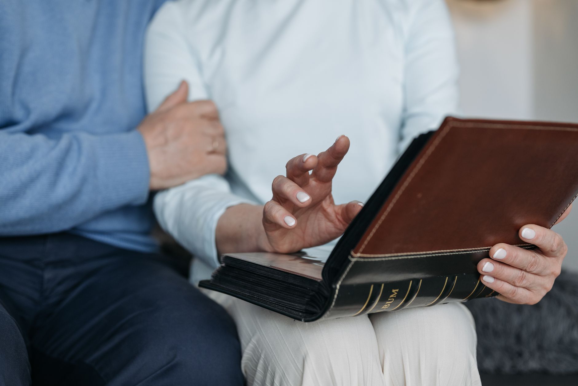 a person holding a photo album